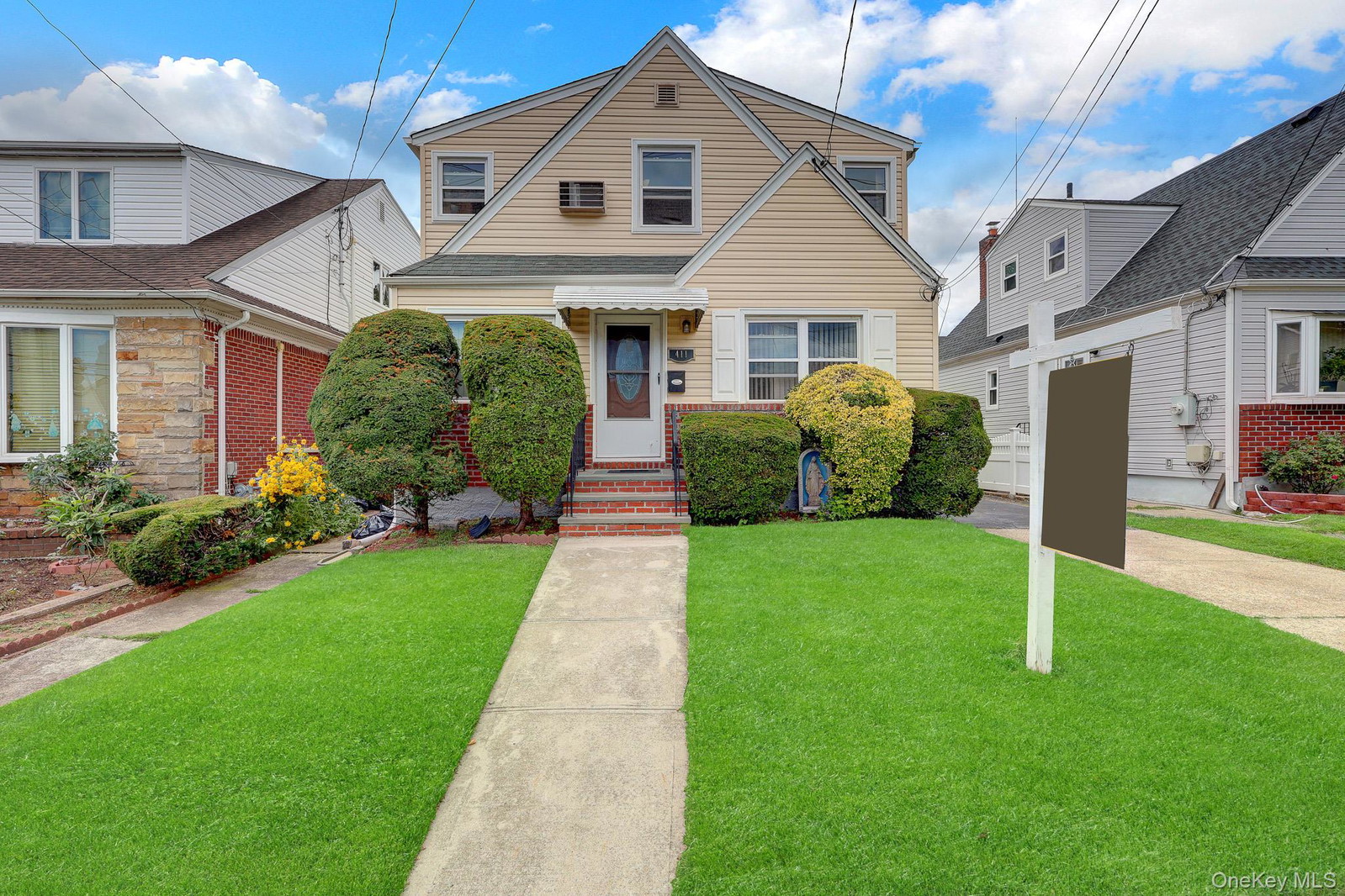 Biji Thomas | ZI Realty LLC in New Hyde Park, NY | OneKey® MLS